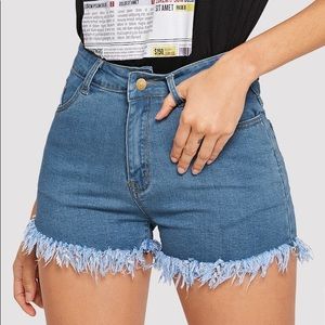 Frayed denim shorts.